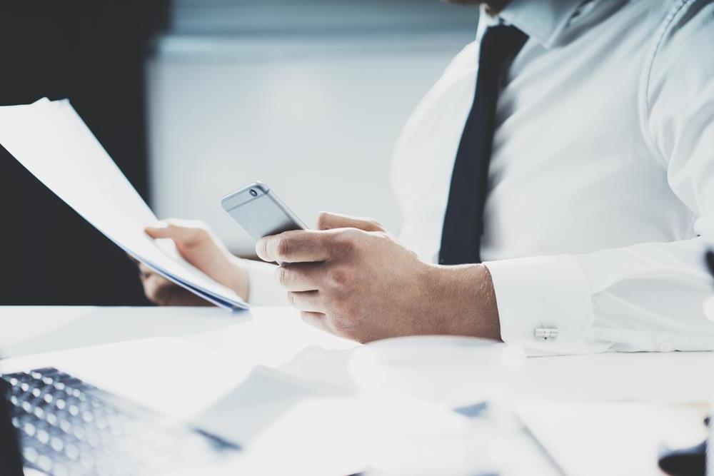 Close-up of businessman viewing coaching materials